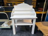 a white desk with a shelf and a chair in front of it