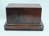 an old wooden box with a lid on a white background