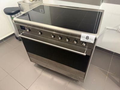 a stainless steel stove with a glass top in a kitchen