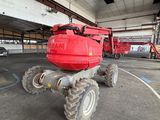 a large red machine that is parked in a parking lot