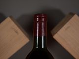 a bottle of wine that is sitting on a table
