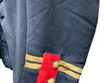 a close up of a military uniform with a red and yellow stripe