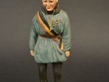 figurine of a man in a military uniform standing on a base