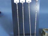 a picture of a display of silver jewelry on a table