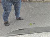 a woman walking in the rain with an umbrella