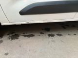 a white car parked on the side of the road
