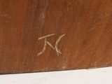 a close up of a wooden box with a bird on it