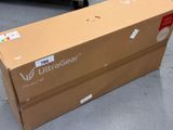 a box that is sitting on the ground in front of a truck