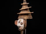 a close up of a sculpture of a head on a stand