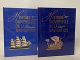 two books on a white surface with a blue cover