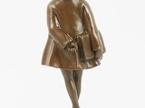 bronze statue of a girl holding a book on a black base