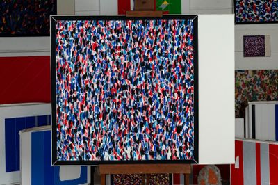 a picture of a painting on a easel in a room