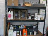 a shelf with many items on it in a garage