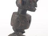 sculpture of a woman ' s head on a wooden base