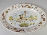 une assiette sur laquelle est représenté un canard et ses canetons