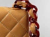 chanel brown leather bag with red beads and chain strap