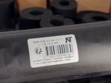 a box of rolls of black tape on top of each other