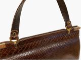 an image of a brown snake skin purse on a white background