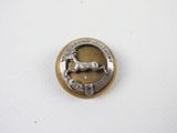 an image of a silver and gold button with a horse on it