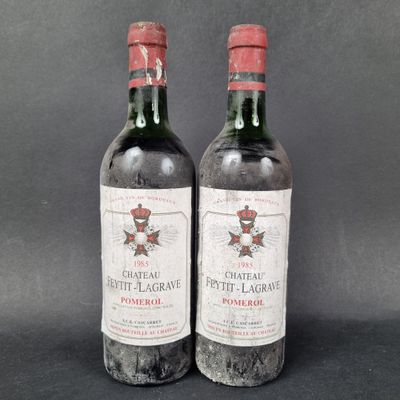 two bottles of chateau petit lagrave wine on a black background
