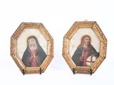 deux tableaux représentant Jésus et Marie, dans des cadres dorés, sur fond blanc