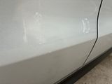 a close up of a car with a broken door handle