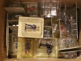 a box full of plastic toys that are in a box