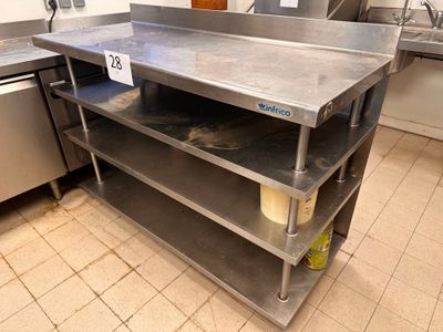 a stainless steel work table in a commercial kitchen