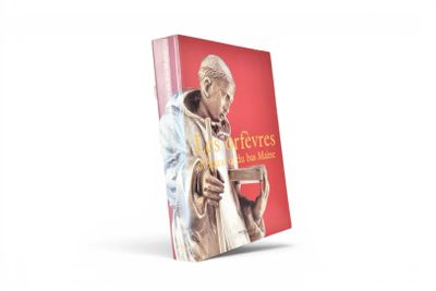 un livre sur lequel figure la photo d'un homme tenant un verre de vin