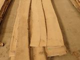 many pieces of wood that are laying on the ground