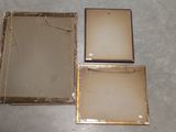 three pieces of metal are sitting on the floor next to each other