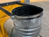 a metal bucket that is sitting on top of a table