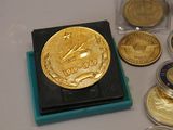 a lot of gold and silver coins sitting on a table