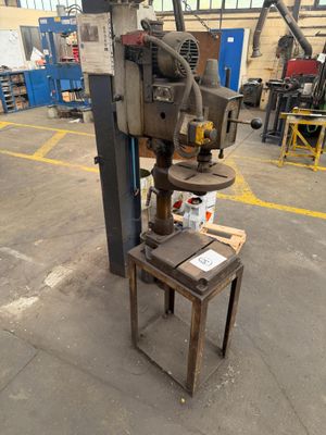 the machine is sitting on the table in the warehouse