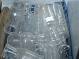 many empty plastic bottles inside of a refrigerator