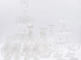 a lot of wine glasses that are sitting on a table