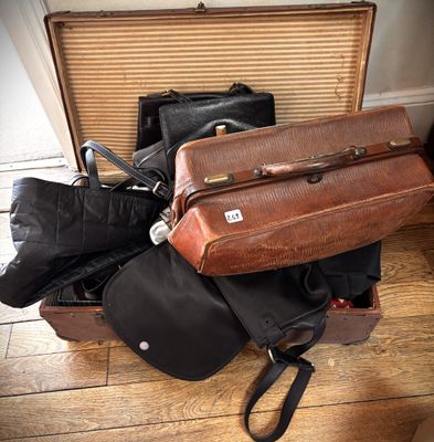 several pieces of luggage sitting on top of a hard wood floor