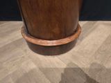 a vase that is sitting on top of a wooden table