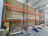 a large room with a lot of shelves and pallets in it