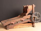 a wooden machine that is sitting on a table