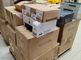 many boxes of electronic equipment stacked on top of each other