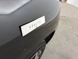 a picture of a car with a sticker on it ' s bumper