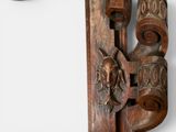 a picture of a wooden mirror with carvings on it