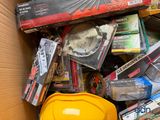 a cardboard box full of tools and other items