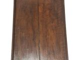 an old wooden tray with a handle on a white background