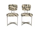 pair of mid century modern chrome and upholstered dining chairs
