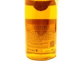 an image of a bottle of alcohol sitting on top of a white surface