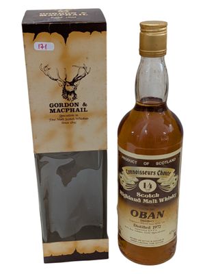 an image of a bottle of whisky next to a cardboard box