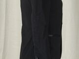 a mannequin wearing a black jacket on a white mannequin