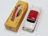 a small toy car that is sitting next to a box
